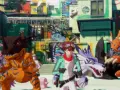 Un chico y sus Digimon, incluyendo a Agumon y Gabumon, se encuentran en una ciudad colorida. Es un momento de **digimon story time stranger**.